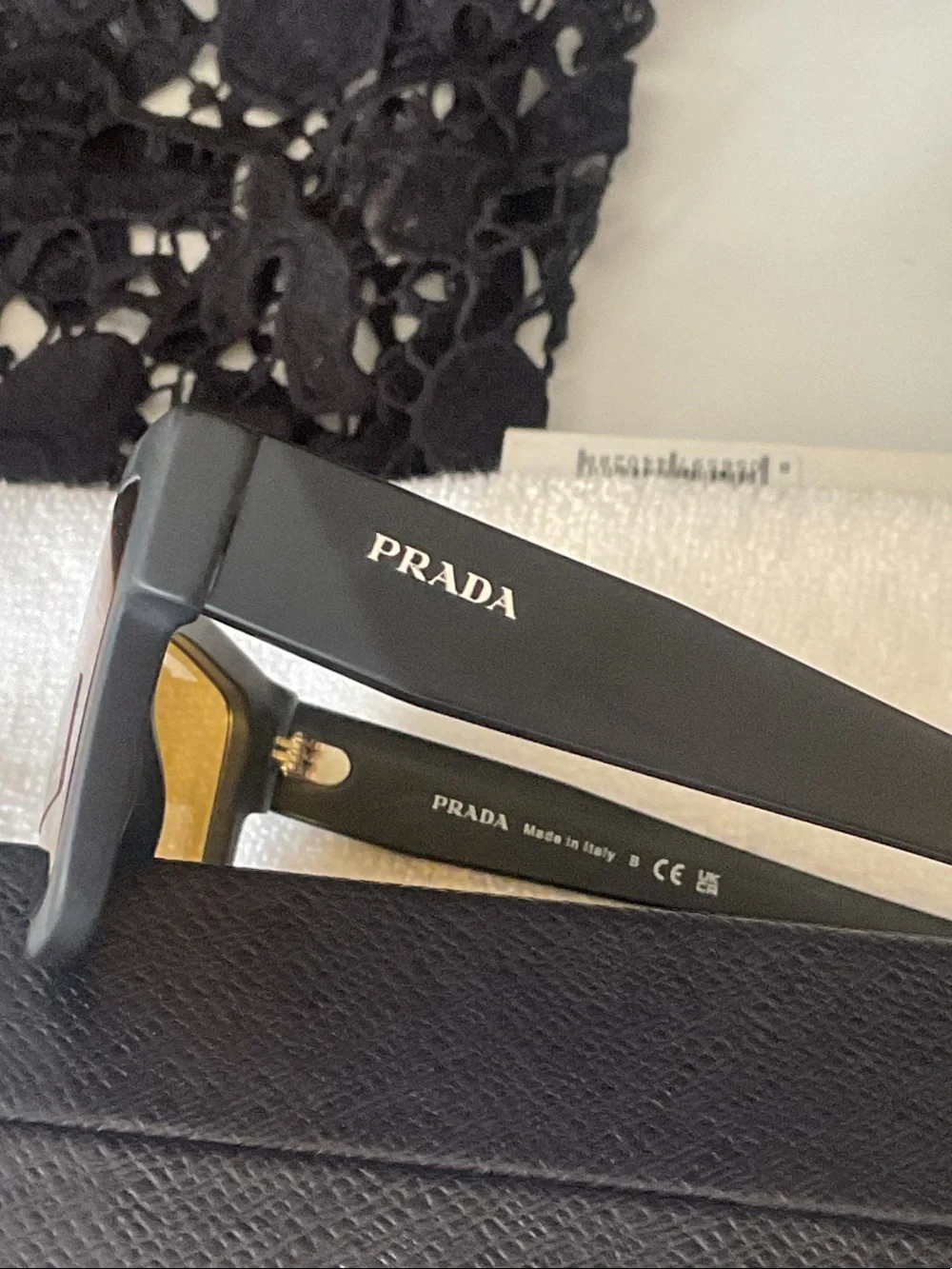 Prada Matte Black Rectangular Sunglasses with Amber Lenses